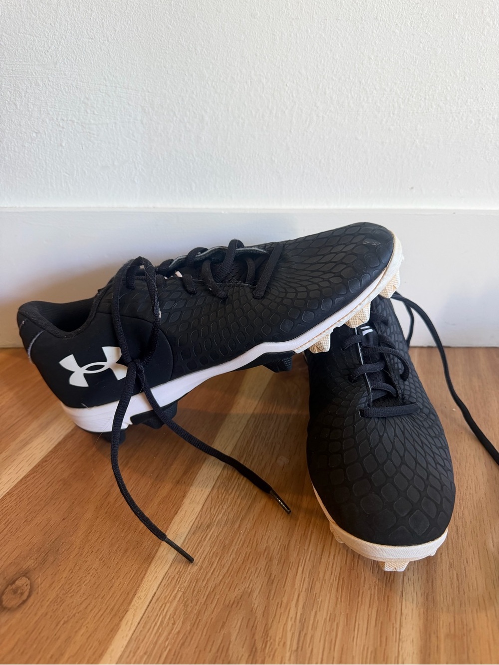 Under Armour women’s Black and White Cleats